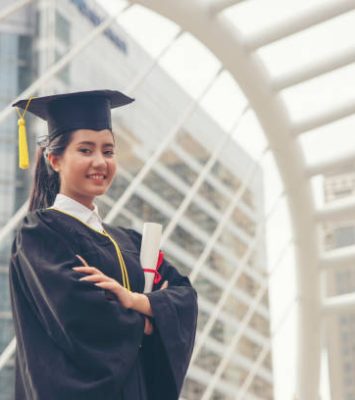 Graduate Student and Success Education in University Concept. Happy Asian student woman graduate diploma and MBA degree in asian college.